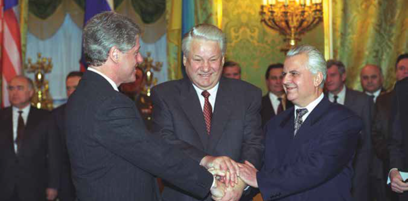 image of three men shaking hands at the same time