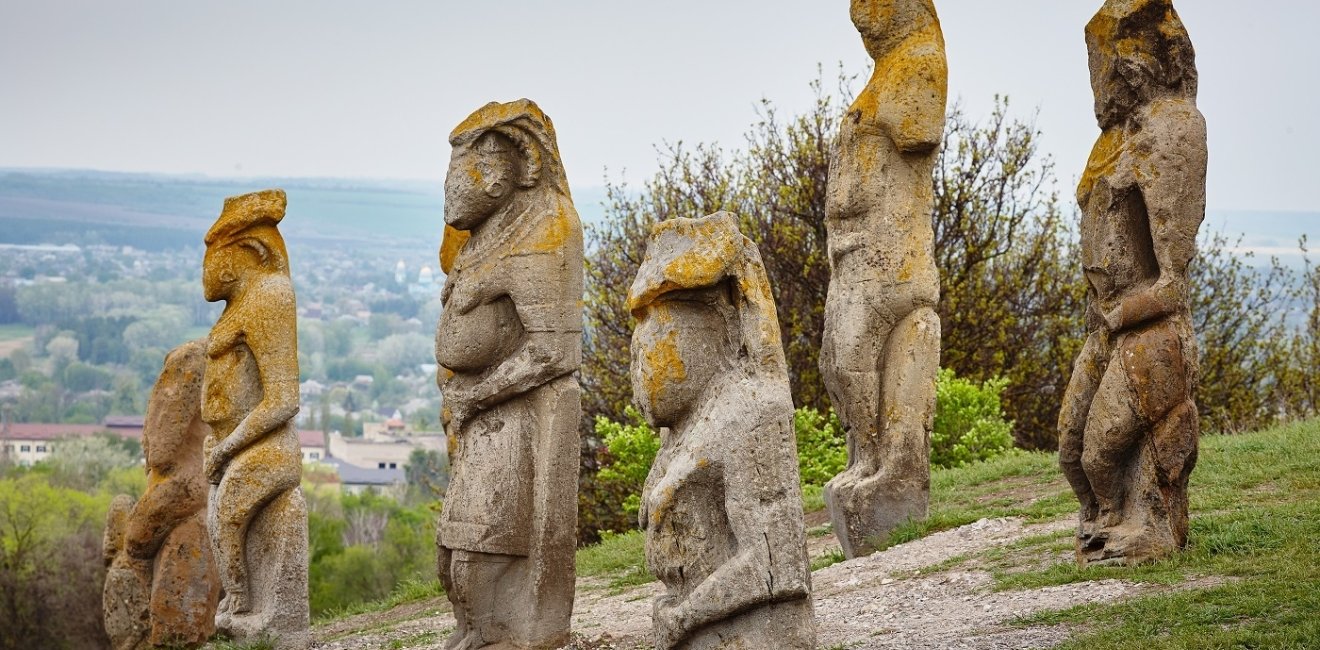 image of ancient statues on a hillside 