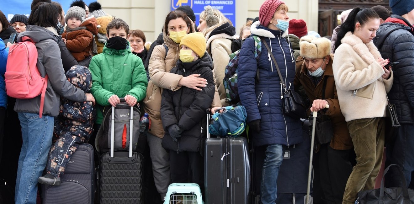 Lviv, Ukraine - February 26, 2022. People in railway station of western Ukrainian city of Lviv waiting for the train to Poland.