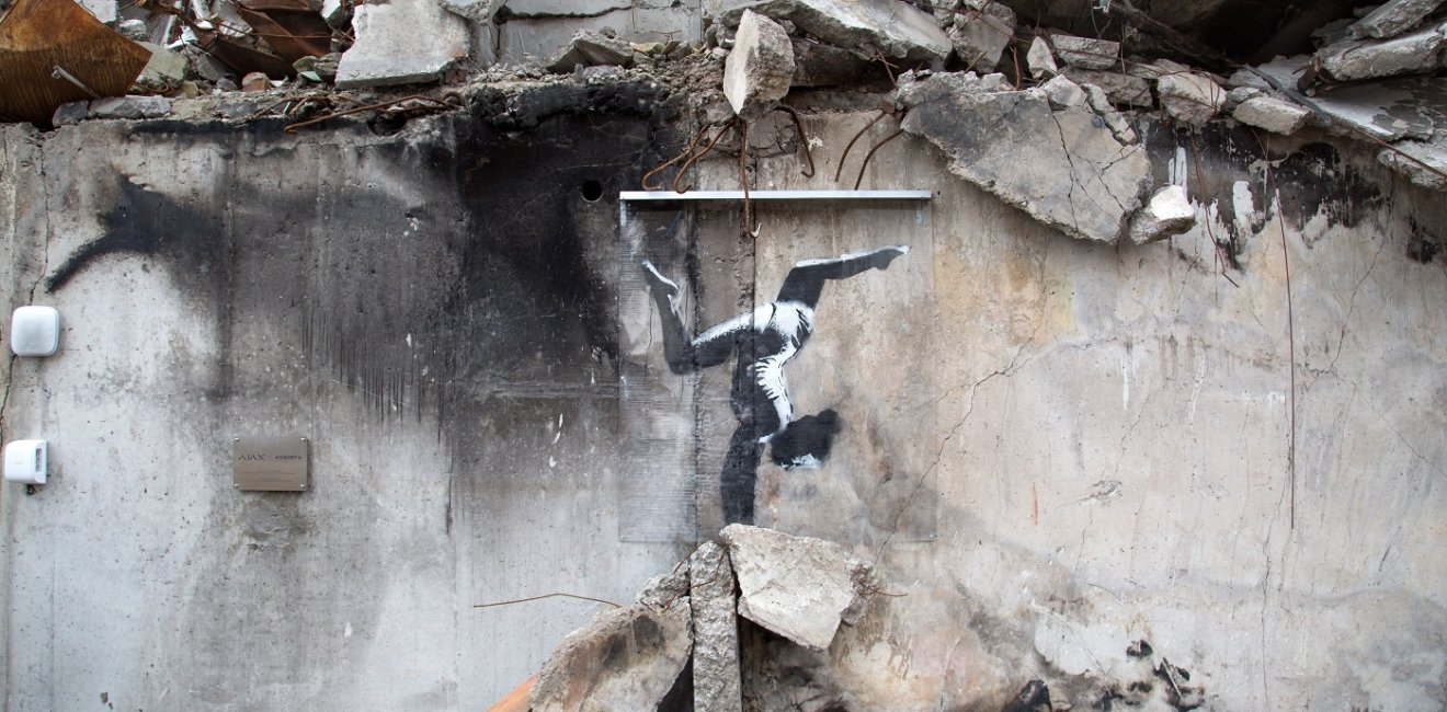 Graffiti art of a gymnast in rubble