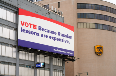 27 SEP 2020- View of a political ad on a billboard saying VOTE because Russian lessons are expensive on a Manhattan Mini Storage building in Manhattan, New York.