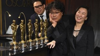 Han Jin Won, from left, Bong Joon-ho, and Kwak Sin Ae at the Oscars