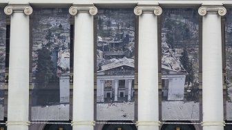 Theater facade, banner showing destroyed Mariupol Theater