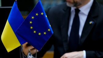 EU and Ukraine flags on conference desk