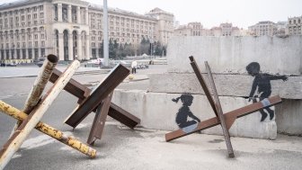 Czech Hedgehogs with street art making it look like children on a seesaw