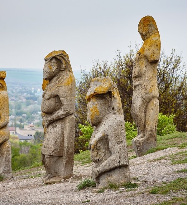 image of ancient statues on a hillside 