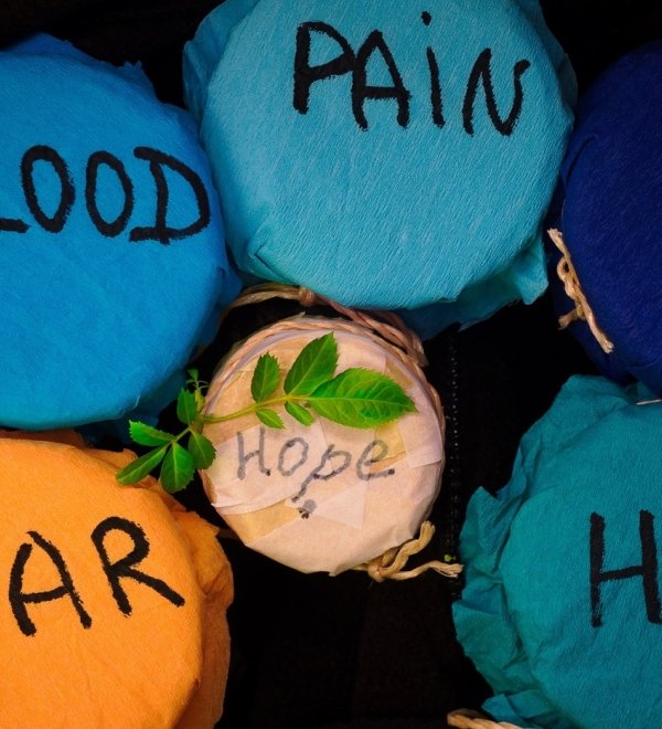 Jars with labels "War," "Blood," "Pain," "Hate," "Hope"