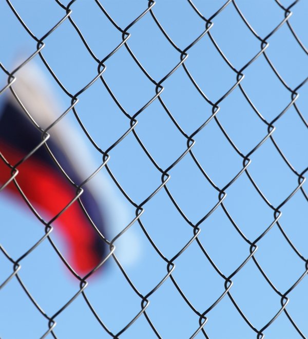 The Russian flag behind fence