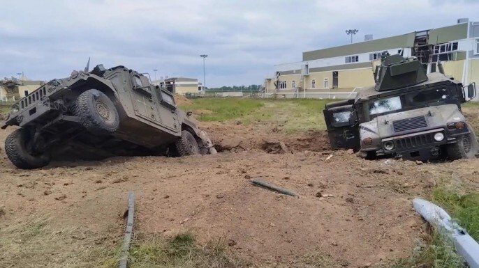Humvees in ditch