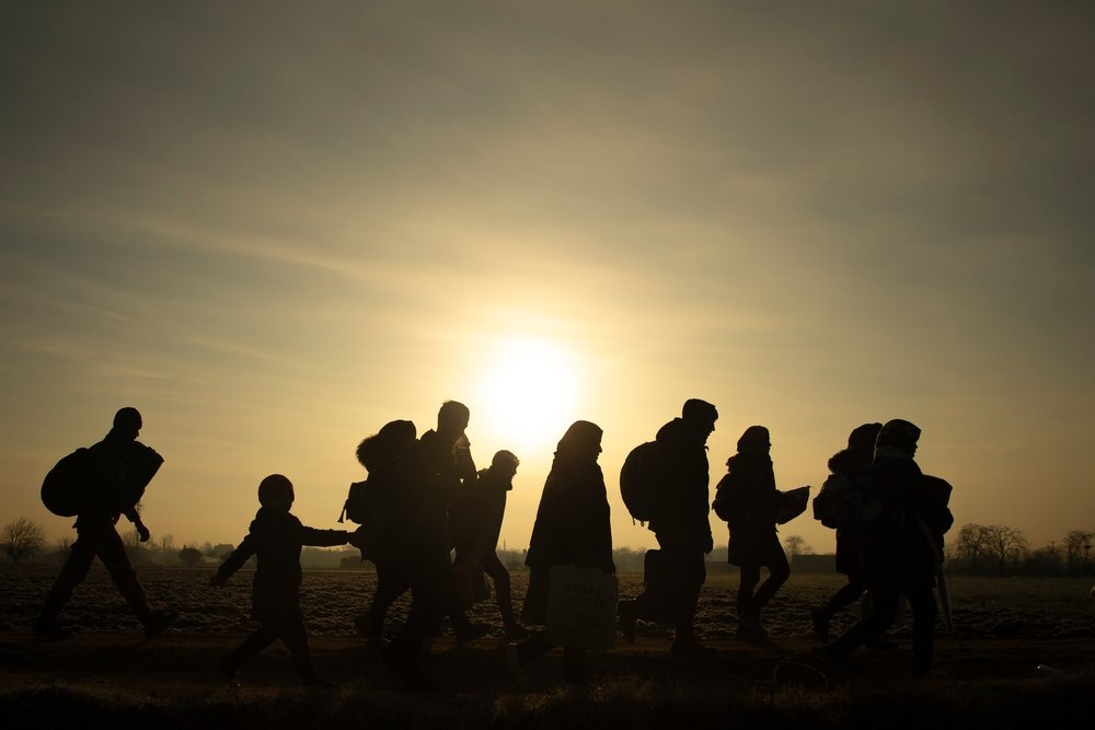 Migrants walk towards...border crossing...March 1, 2020.
