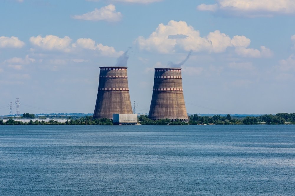 Image of nuclear power plant cooling towers across water
