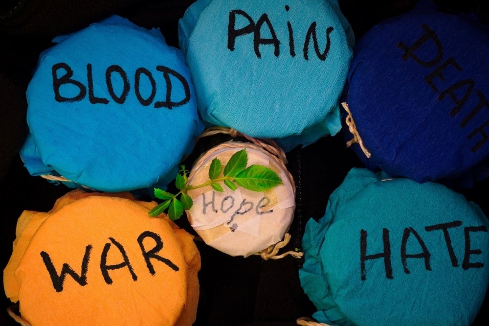 Jars with labels "War," "Blood," "Pain," "Hate," "Hope"