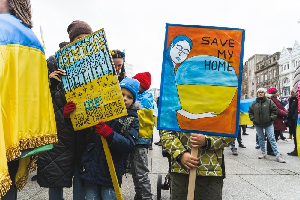 Protesters with signs against the Russian invasion