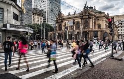 People walking across the street in Sao Paulo, Brazil.