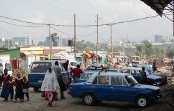 Image - Cabs and minivans wait at a market in Addis Ababa