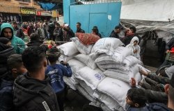 Palestinians crowd to receive food supplies at a UNRWA school after some Eur and American countries announced the cessation of support for UN in the Gaza Strip, in Gaza Strip, on January 24, 2024.