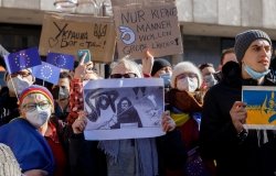 Group of protesters holding sign 