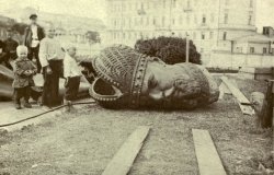 Historical photo of a toppled statue 